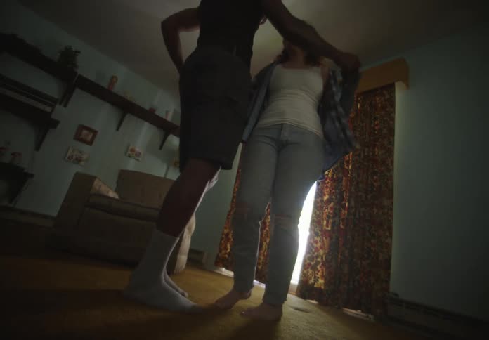 Couple of a man and a woman dancing in a room