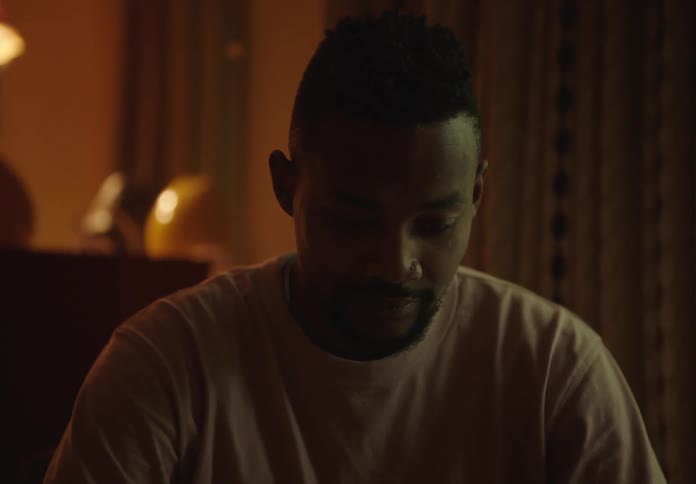 Portrait of a man sitting in a room