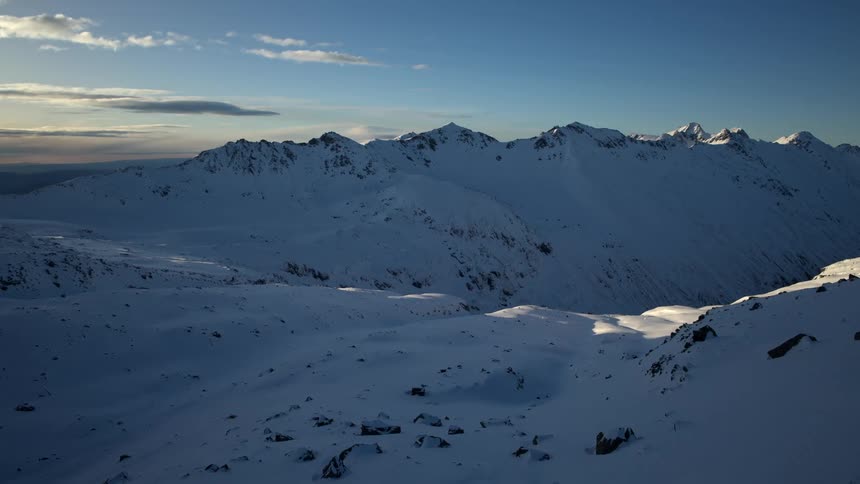 A large mountain range covered in snow