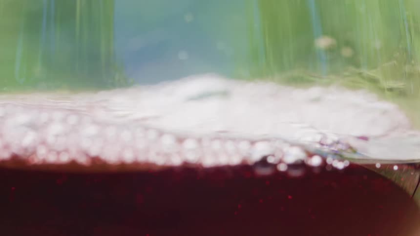 Close up of red wine being poured in a glass