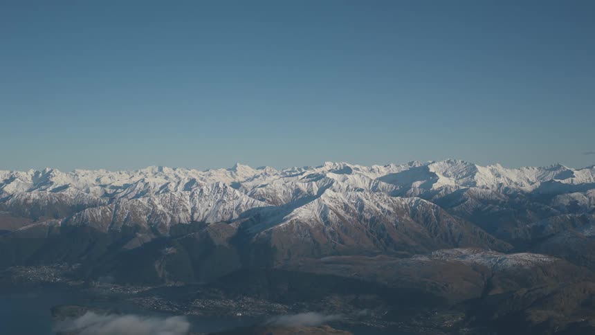 A vast mountain range with snow covered peaks