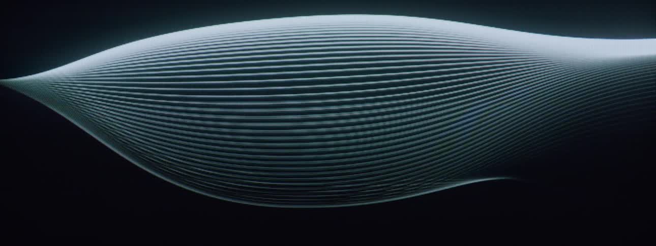 Abstract light trails creating an artistic pattern against a dark background