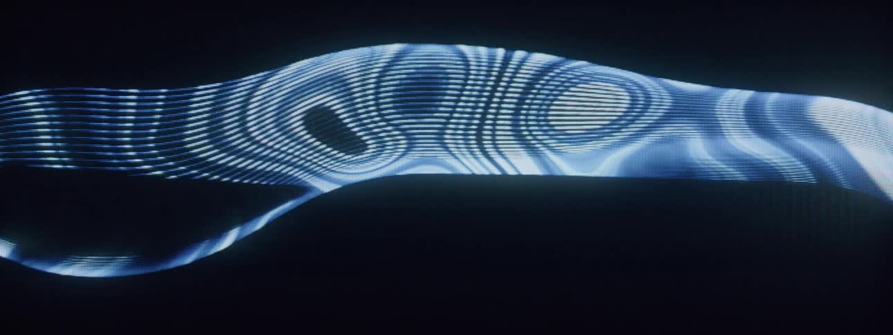 Lines in different shades of blue wind around each other to form circles that come and go