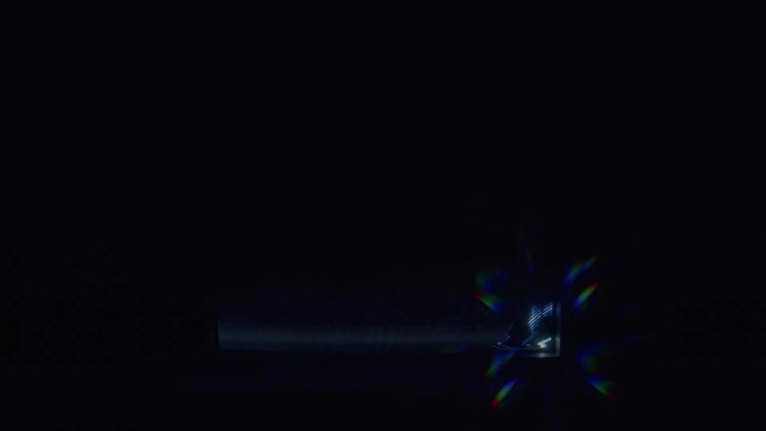The white lines are spinning around and moving upwardit is contained inside of a white frame that is seen when the lines come close to it