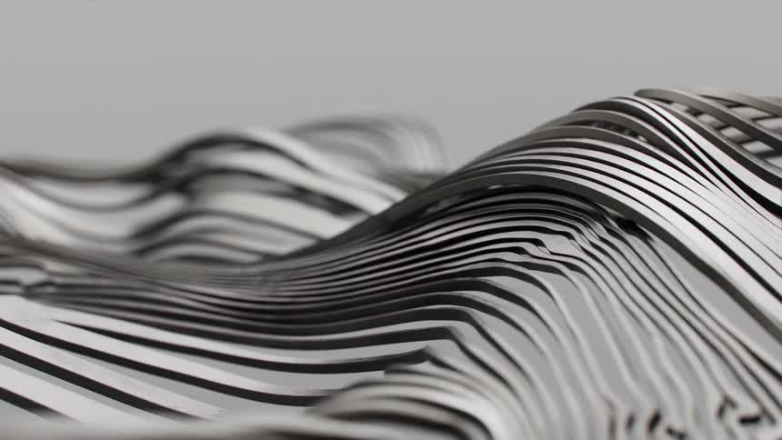 Series of wavy metallic lines that create a threedimensional visual effect
