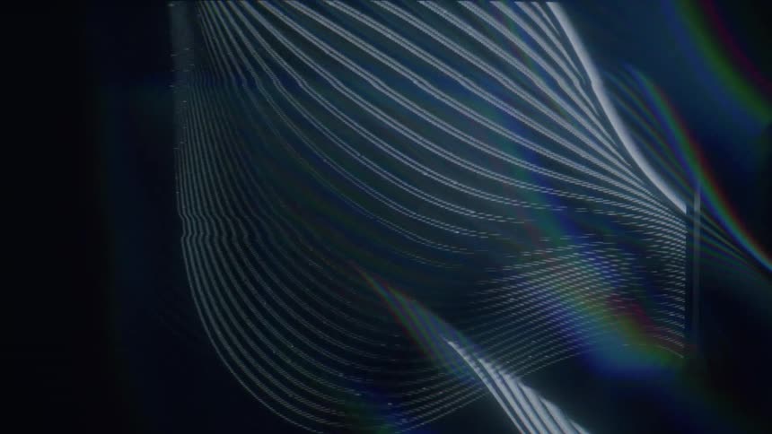 Rainbow bands of light weave with lighter bands that twist around with intermittent static