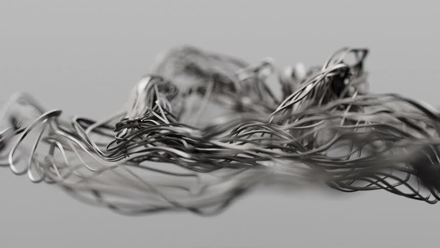 Intertwined gray lines in motion against a blurred gray background