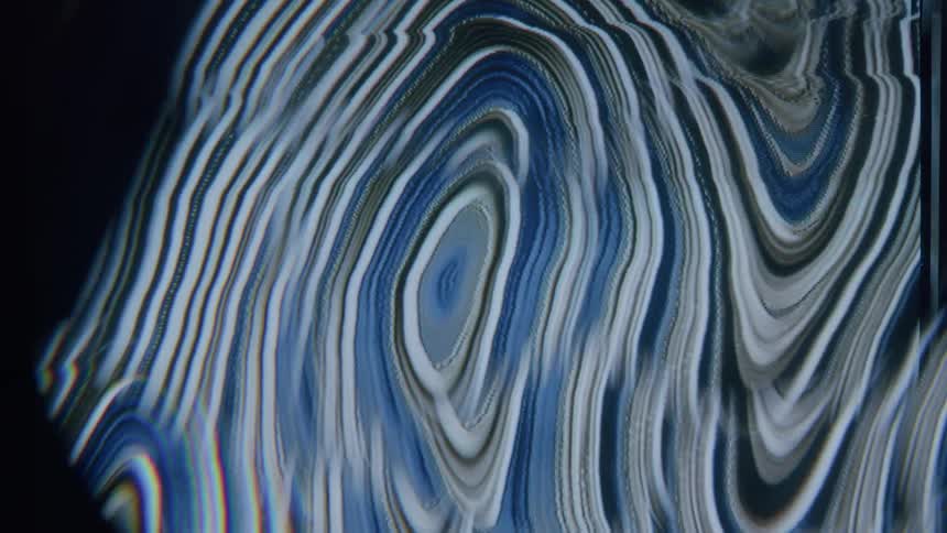 Layers flowing through screensaver form circular and wavy shapes