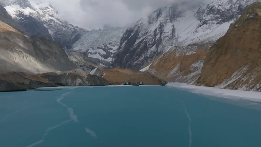 A mountain fjord filled with frozen water