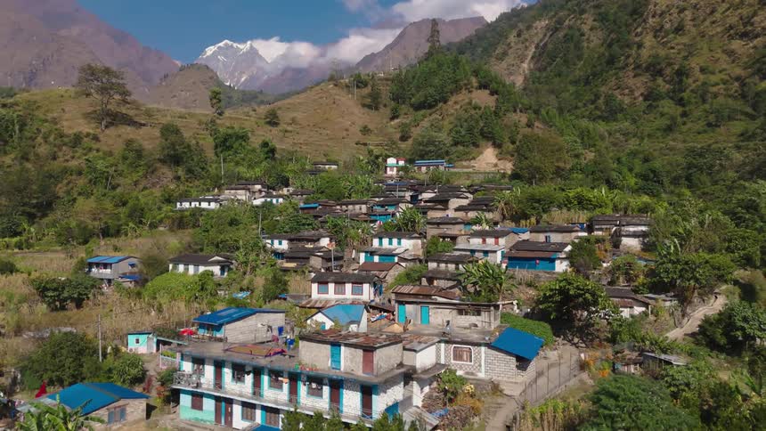 Rows of shacks sit by the mountain