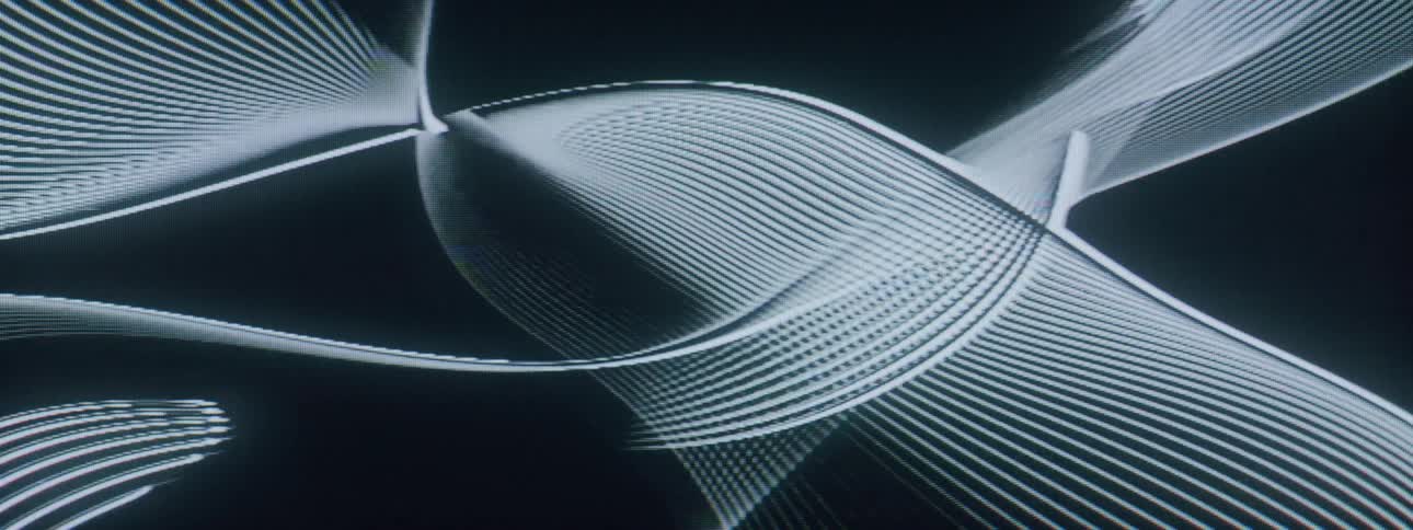 Moving lines on screensaver form shapes against a dark background