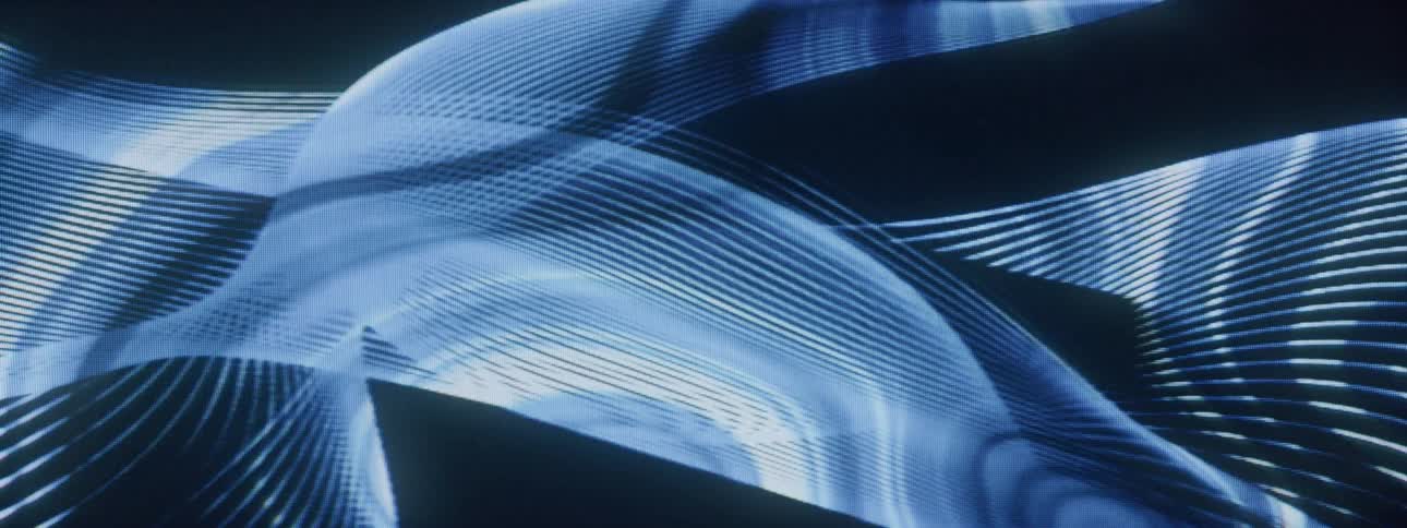 Abstract projection of wavy lines on a dynamic dark background