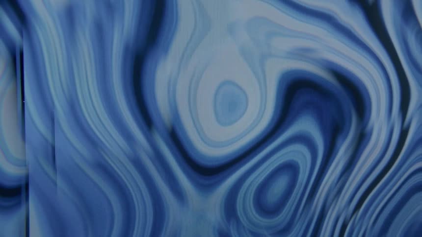 Projection of an abstract and psychedelic blue liquid in motion