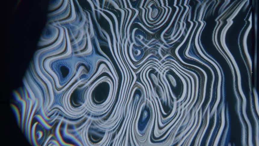 Psychedelic wavy and abstract pattern in blue tones of moving lines