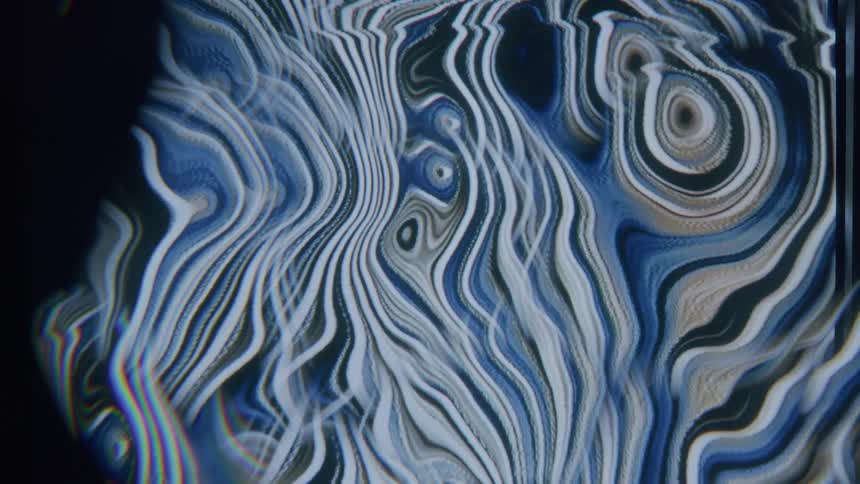 Bands of muted colors morph forming shapes and swirls