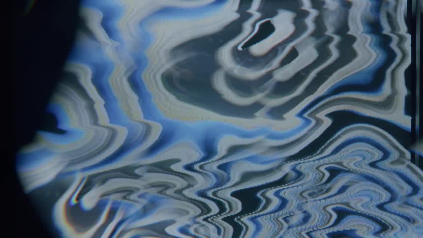 Bands of multiple muted colors merge and flow forming shapes and patterns in screensaver