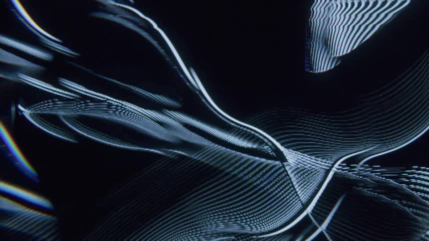 The screensaver flickers with lit lines