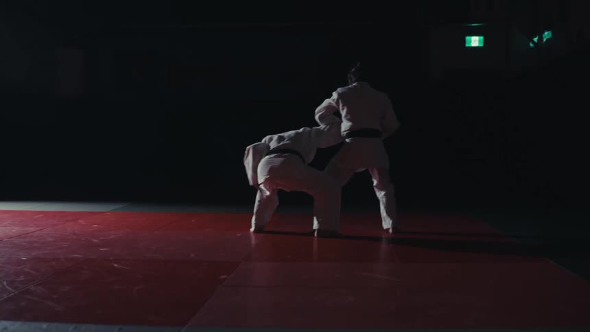 Two men are having a judo match