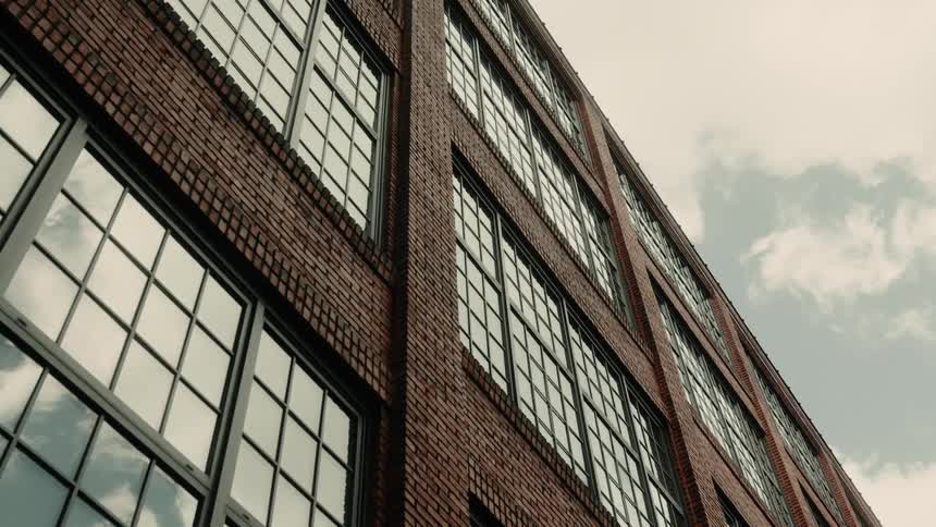 The building is made of brick with large glass windows