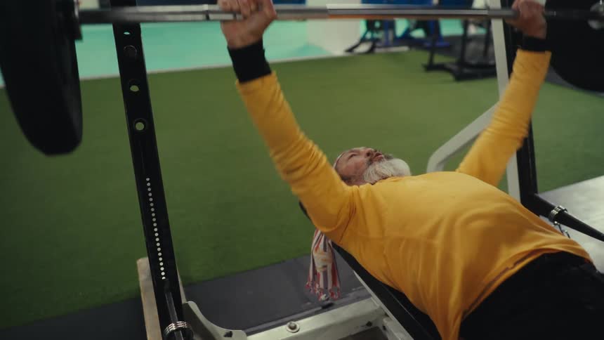 A man lifting weights in a gym
