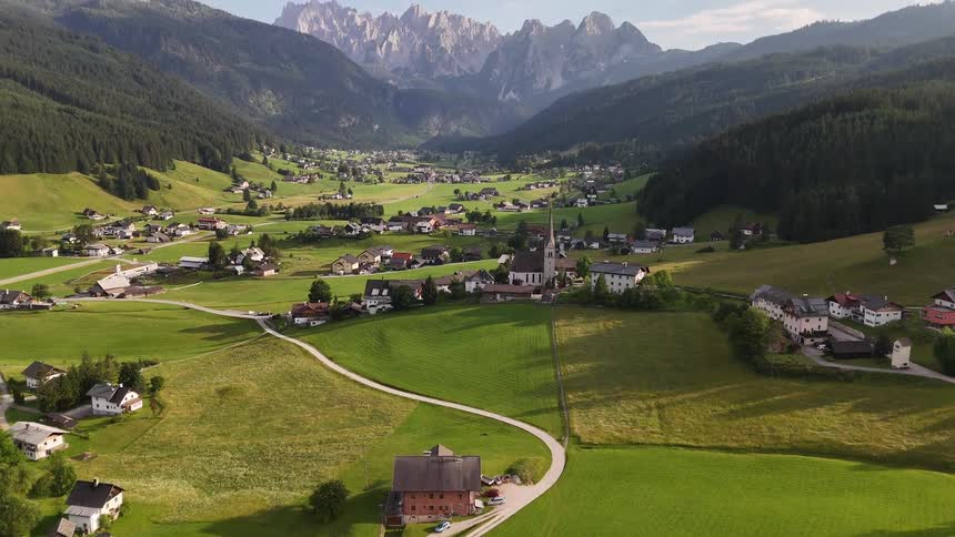 Village in the valley between mountains on a sunny day