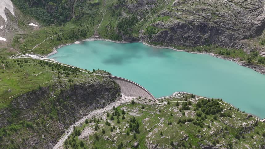 A dam and a reservoir in a mountain valley
