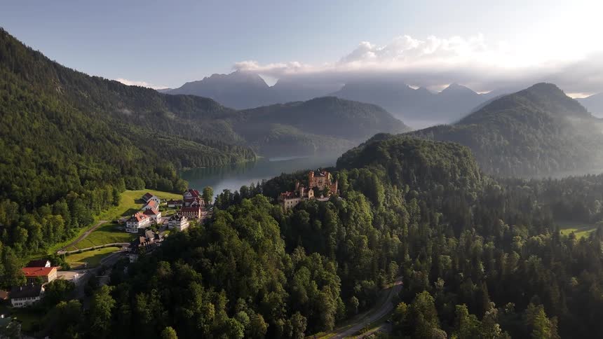 Castle sits high above the village nestled in the forest of the mountains