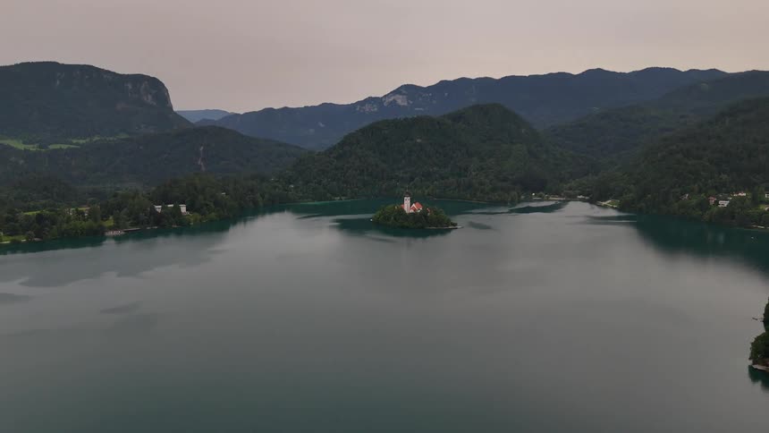 Aerial panorama of a lake surrounded by a mountainous valley