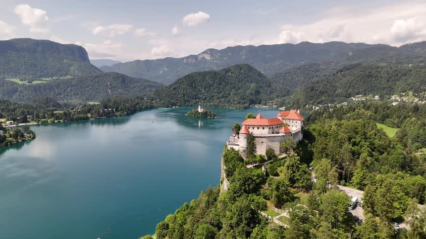 Castle on a cliff overlooking the lake and mountains