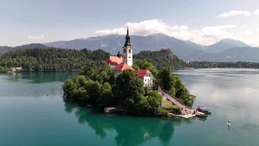 Tourists visit a castle built on a small island