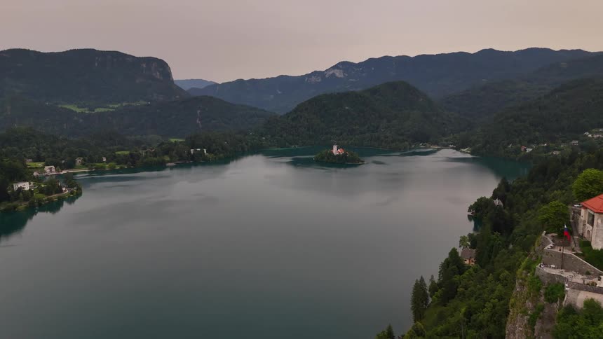 A bay of water with some hills and buildings around