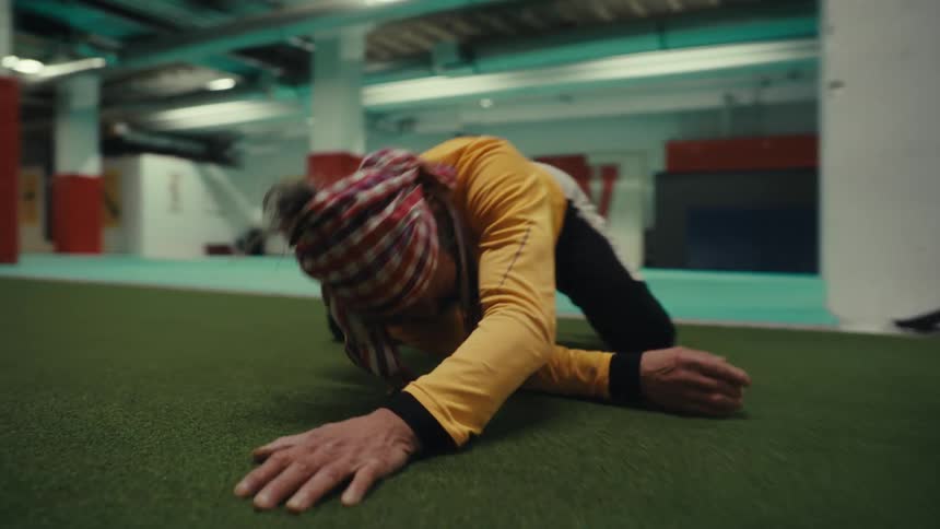 A man is stretching on the floor