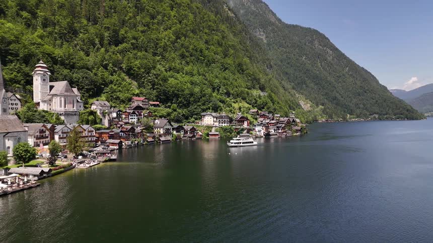 A boat sails past the small town