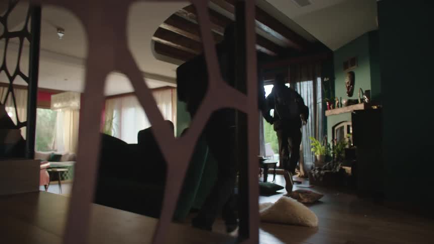 Two men run out of a house they robbed