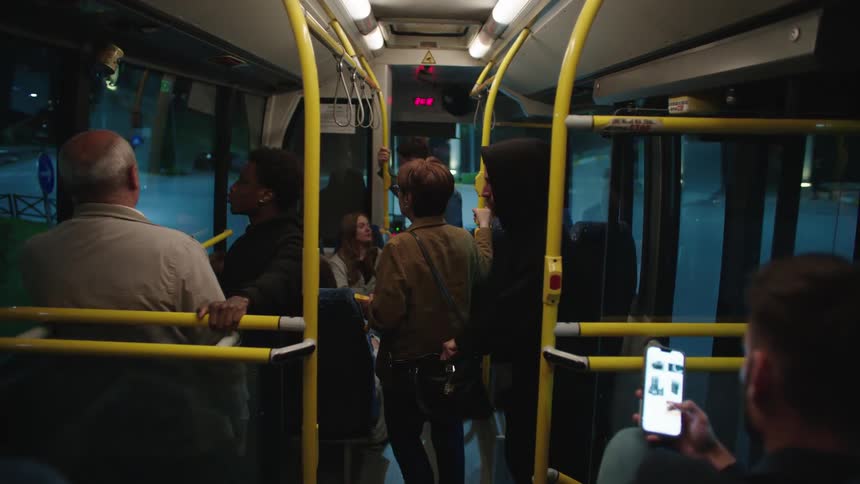 A man steals from a womans bag on the bus