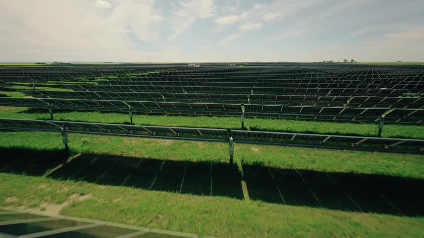 Detailed view of a large solar farm with numerous photovoltaic panels