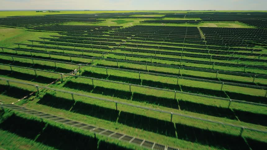 Energetic aerial view of solar farm during summer