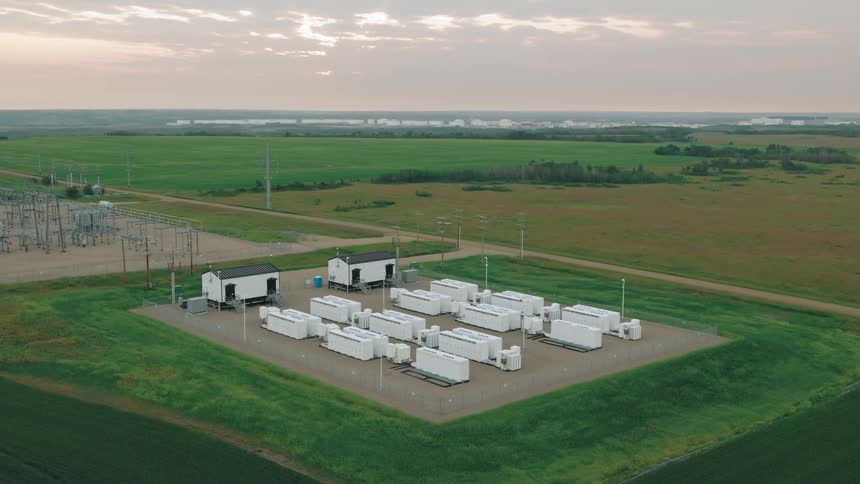 An industrial facility with white electrical structures