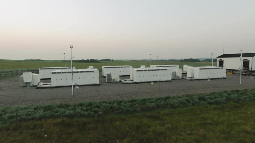 Aerial view of power generators in a field