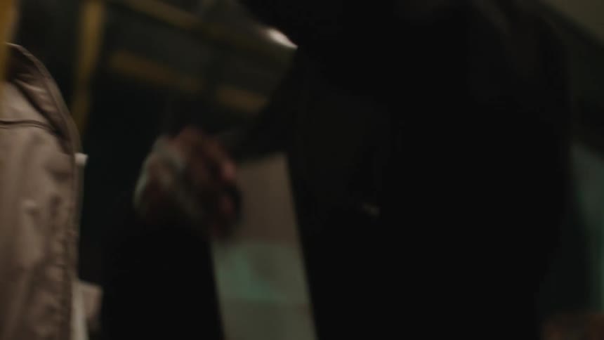 Man stealing an iphone from an elderly man on the bus