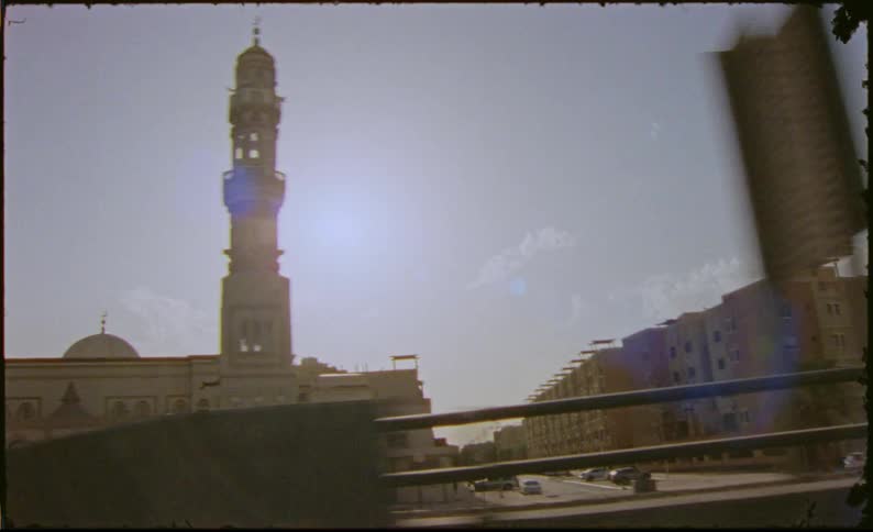 Mosque next to buildings in a city