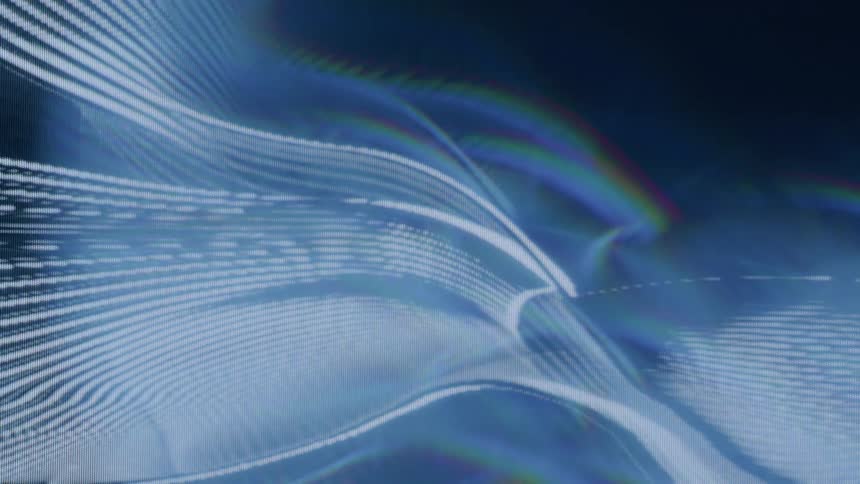 Lines in blue tones move fluidly on a black background
