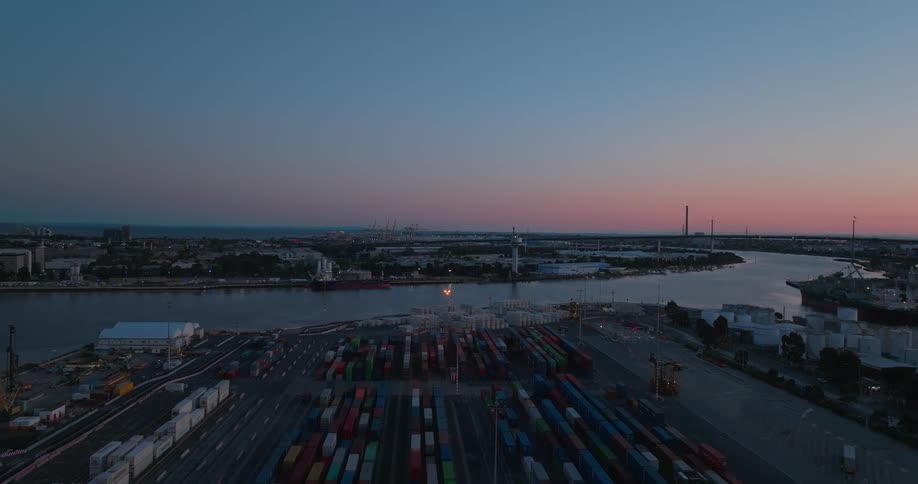 Aerial panorama of a port with containers under a purple sky in the morning