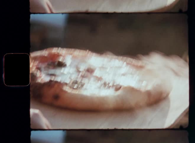 Pizza being removed from the oven
