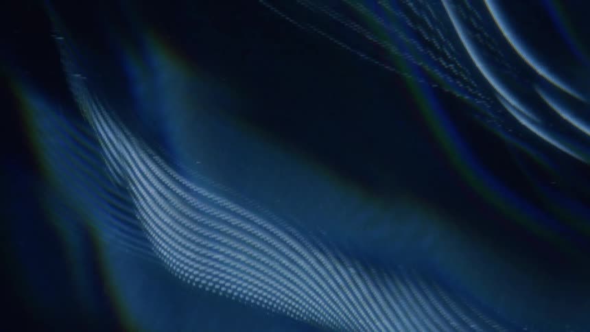 Abstract design with flowing lines in blue tones on a black background