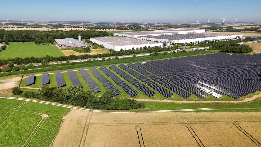 The fields are full of solar panels and windmills