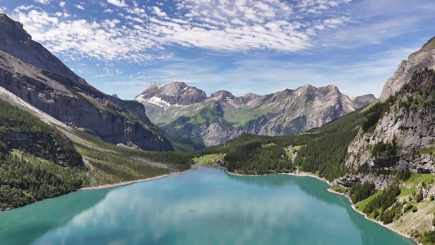 Aerial of a lake surrounded by a mountain range