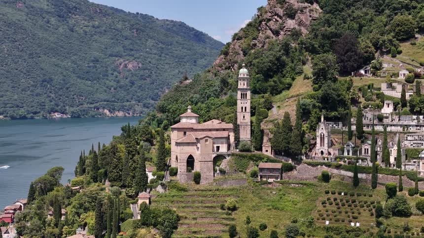 A church and other buildings on the side of a mountain