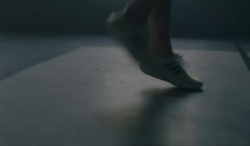 Close up of a persons legs jumping in motion in an indoor environment
