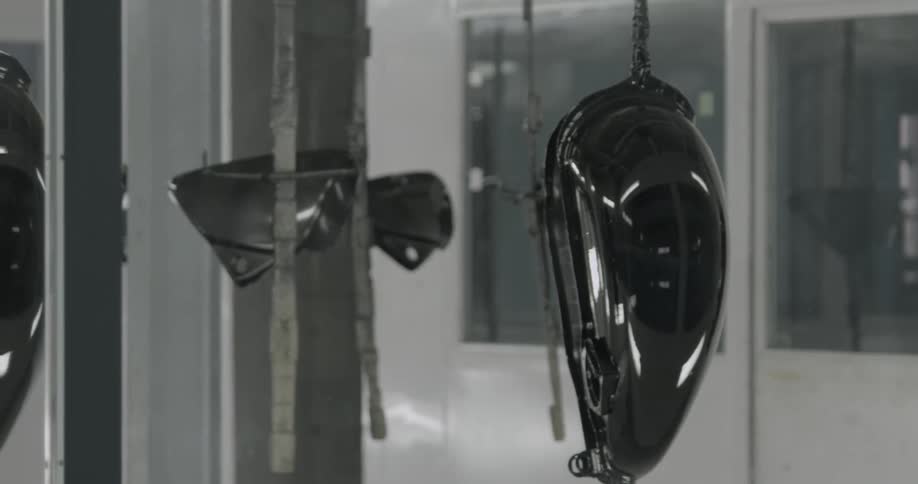 Metal objects hanging next to a window in a shop